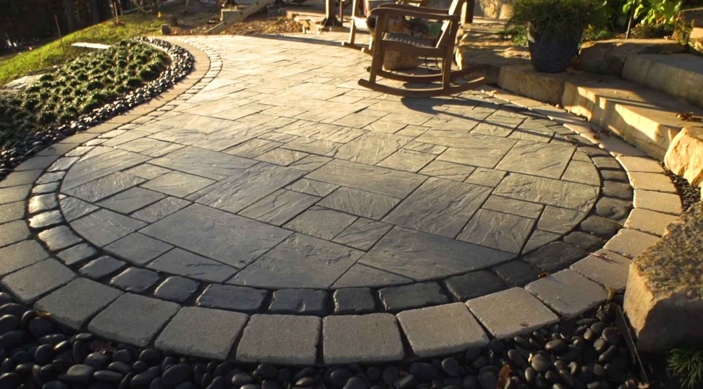 Circular paver patio with decorative stone border in Fontainebleau, FL