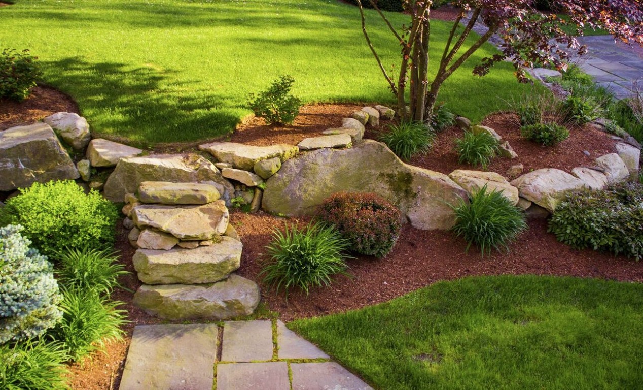 Natural stone landscaping and garden beds in Fontainebleau, FL